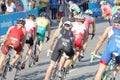 Rear view of large group of male cycling triathlon competitors