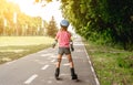 Little girl roller skating in park