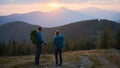 Hiking in the mountains at sunset in summer. Royalty Free Stock Photo