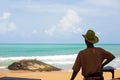 Rear view of male asian lifeguard looked at wave from a beach of Khao Lak, tourist attractions in Phang Nga, Thailand. Summer