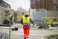 Rear view of male builder construction worker on building site wearing hard hat Royalty Free Stock Photo