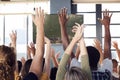 Rear View Of Male And Female Friends Celebrating Whilst Watching Game On Screen In Sports Bar Royalty Free Stock Photo