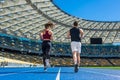 rear view of male and female joggers running on track Royalty Free Stock Photo