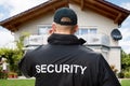 Male Security Guard Standing Outside The House Royalty Free Stock Photo