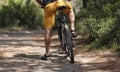 Rear view man on a bicycle stopped on the road Royalty Free Stock Photo