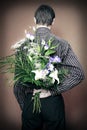 Rear view of man with flowers