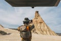 Rear View Of A Man With A Hat Taking A Photo With A Smart Phone From His Van In The Bardenas Desert. Navarre Royalty Free Stock Photo