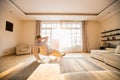 Rear view of man relaxing on modern chair at home Royalty Free Stock Photo