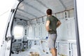 Man standing inside an empty van