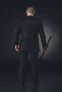 rear view of man in suit with katana sword Royalty Free Stock Photo