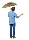 Rear view of a man with an umbrella. Royalty Free Stock Photo