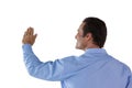 Rear view of mature businessman touching invisible interface Royalty Free Stock Photo