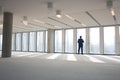 Rear view of mature businessman visiting empty office space Royalty Free Stock Photo