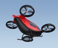 Rear view of metallic red self-driving passenger drone flying in the sky Royalty Free Stock Photo