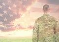 Rear view of military standing against american flag Royalty Free Stock Photo