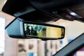 Rear view mirror in modern car with camera and display Royalty Free Stock Photo