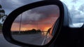 Rear view mirror showing a storm left behind Royalty Free Stock Photo