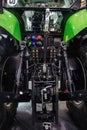 Rear view of modern agricultural tractor in hangar. Hydraulic hitch. Hydraulic lifting frame