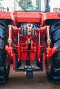 Rear view of modern agricultural tractor. Hydraulic hitch. Hydraulic lifting frame.