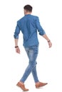 Rear view of a motivated casual man walking Royalty Free Stock Photo