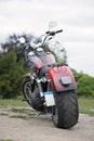 Rear view motorcycle on a green background in summer