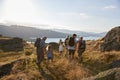 Rear View Of Multi Generation Family Walking On Top Of Hill On Hike Through Countryside In Lake District UK Royalty Free Stock Photo