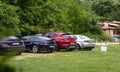 Rear view of multiple Alfa Romeos parked on a car show. Stelvio, 159, GT and Giulia. Many models from older to newest