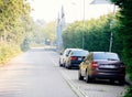 Rear view of multiple cars parked on the almost empty road in central Haarlem