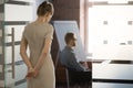 Rear view at nervous woman waiting preparing speech for meeting