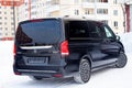 Rear view of new an expensive Mercedes Benz V-class minivan bumper and trunk of a car, a long black limousine, model outdoors, Royalty Free Stock Photo