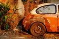 The rear view of old rusty car.