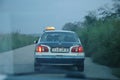 Rear view of one taxi on the street in Congo at dusk. Royalty Free Stock Photo