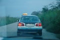 Rear view of one taxi on the street in Congo at dusk Royalty Free Stock Photo