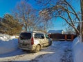 Rear view of an Opel Combo Life passenger van among snowdrifts in the courtyard Royalty Free Stock Photo