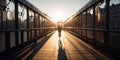 Rear view of a person cycling along a dedicated bike lane, traversing a bridge that spans a majestic river in a