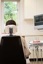 Rear view of person in dentist chair