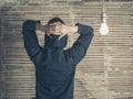 Rear view of person by light bulb Royalty Free Stock Photo