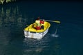 Person exploring cave in boat