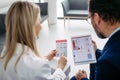 Rear view of pharmaceutical sales representative talking with doctor in medical building. Ambitious male sales Royalty Free Stock Photo