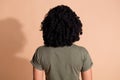 Rear view photo of adorable person with perming coiffure dressed khaki t-shirt demonstrate hairdo isolated on pastel