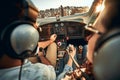 Rear view of pilot and copilot in private cockpit of small plane Royalty Free Stock Photo