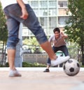 No one gets past him. Rear-view of a player ready to kick a soccer ball while the goalie stands ready. Royalty Free Stock Photo