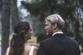 Rear view portrait of adorable just married couple. Turkish middle-aged long-haired woman and her new husband - Royalty Free Stock Photo