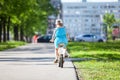 Rear view of pretty girl riding bicycle in park Royalty Free Stock Photo