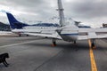 A rear view of a private jet and a dog in the airport of St Moritz Switzerland in the alps Royalty Free Stock Photo