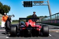 Rear view of racing formula car in racetrack starting grid pole position Royalty Free Stock Photo