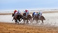 Rear view racing jockeys at Sanlucar de Barrameda Royalty Free Stock Photo