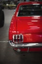 Rear view of a red colored classic ford mustang car on a car show in Fair Izmir Turkey Royalty Free Stock Photo