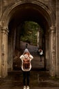 Rear view of redhead woman tourist admiring beautiful architectural places