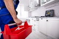 Repairman Holding Tool Box Installing Kitchen Royalty Free Stock Photo